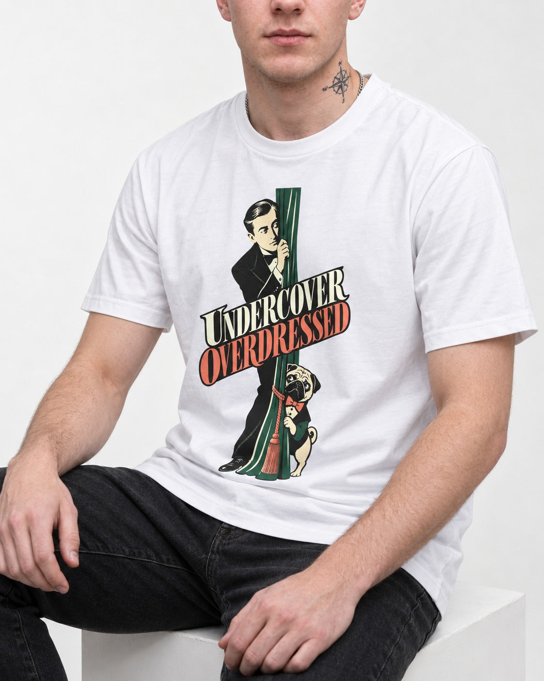 Undercover Overdressed Pug T-Shirt in White, worn by a seated model