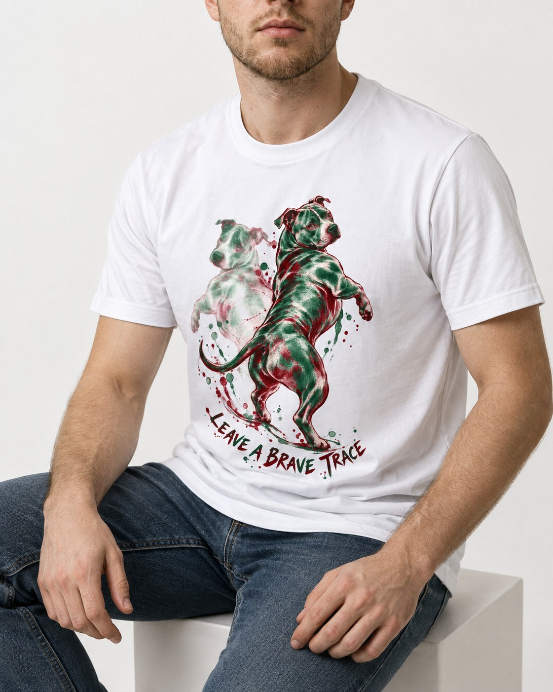 Pitbull's Brave Trace T-Shirt in White, worn by a seated model