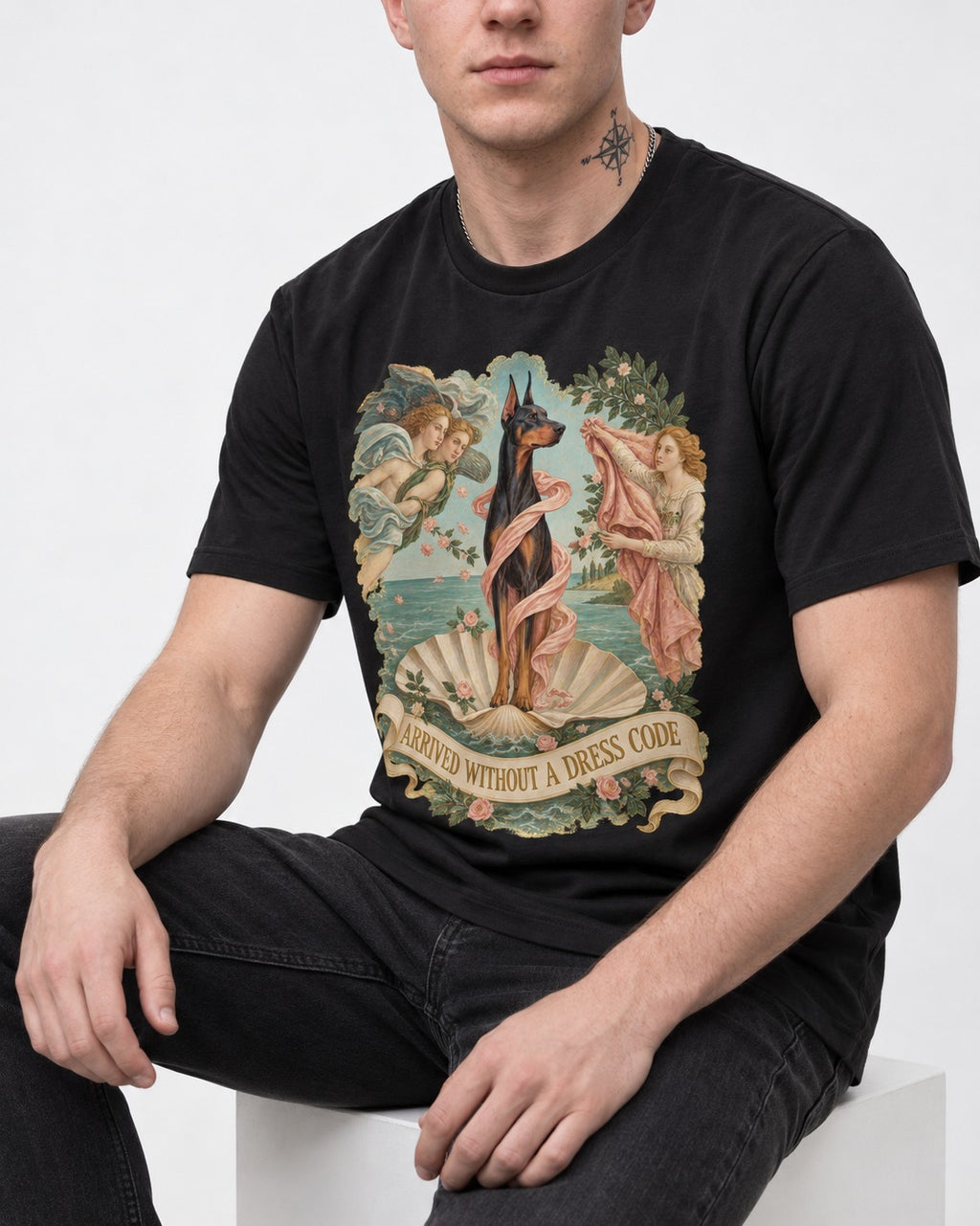 Doberman Arrived Without a Dress Code Renaissance Graphic T-Shirt in Black, worn by a seated model