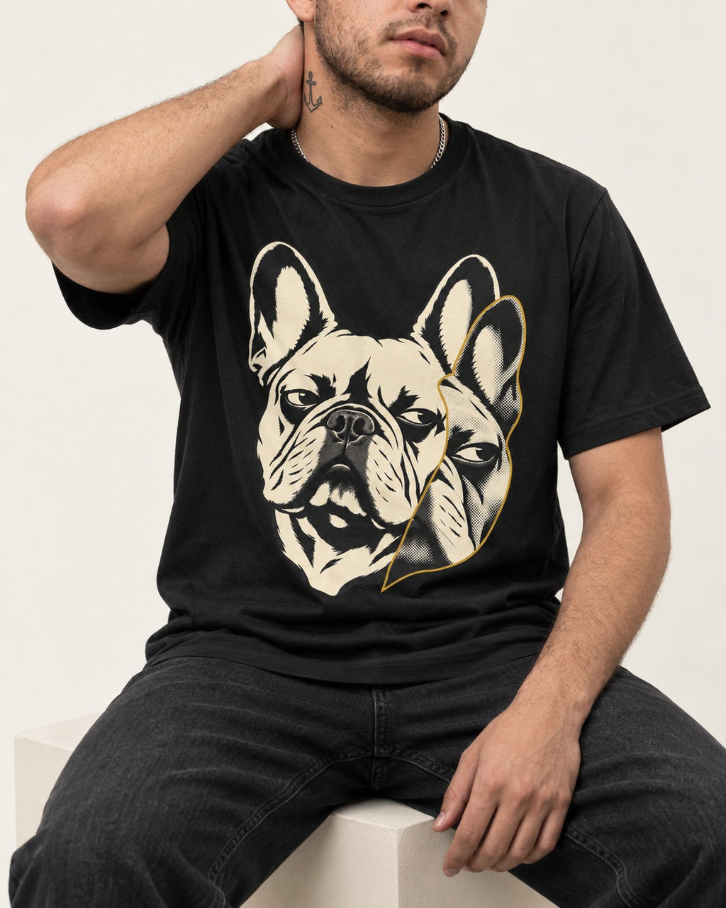 Frenchie Double Crop Side Eye Portrait Graphic T-Shirt in Black, worn by a seated model