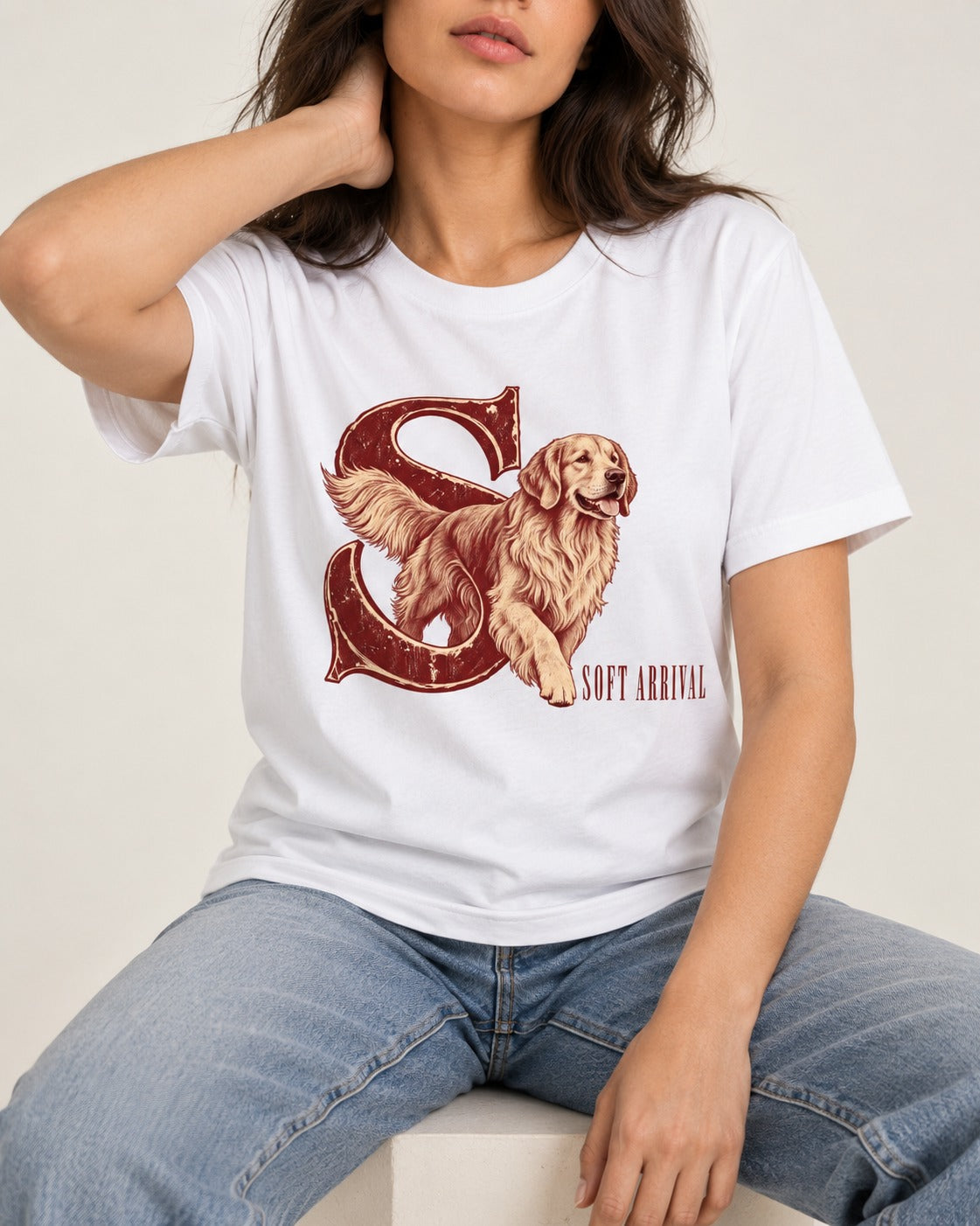 Soft Arrival Golden Retriever T-Shirt in White, worn by a seated model