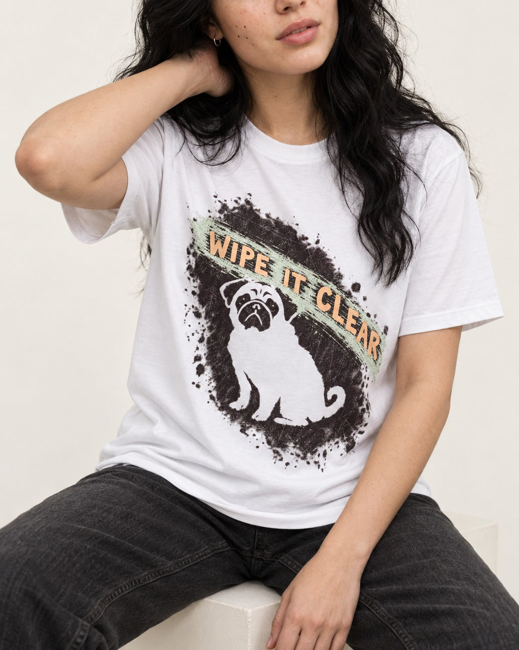 Pug Wipe It Clear T-Shirt in White, worn by a seated model