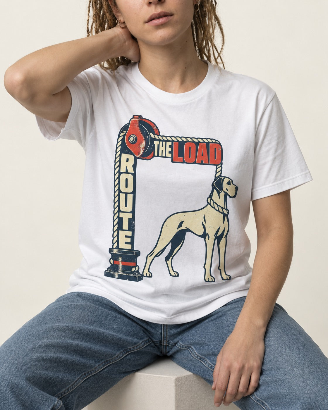Great Dane Route the Load T-Shirt in White, worn by a seated model