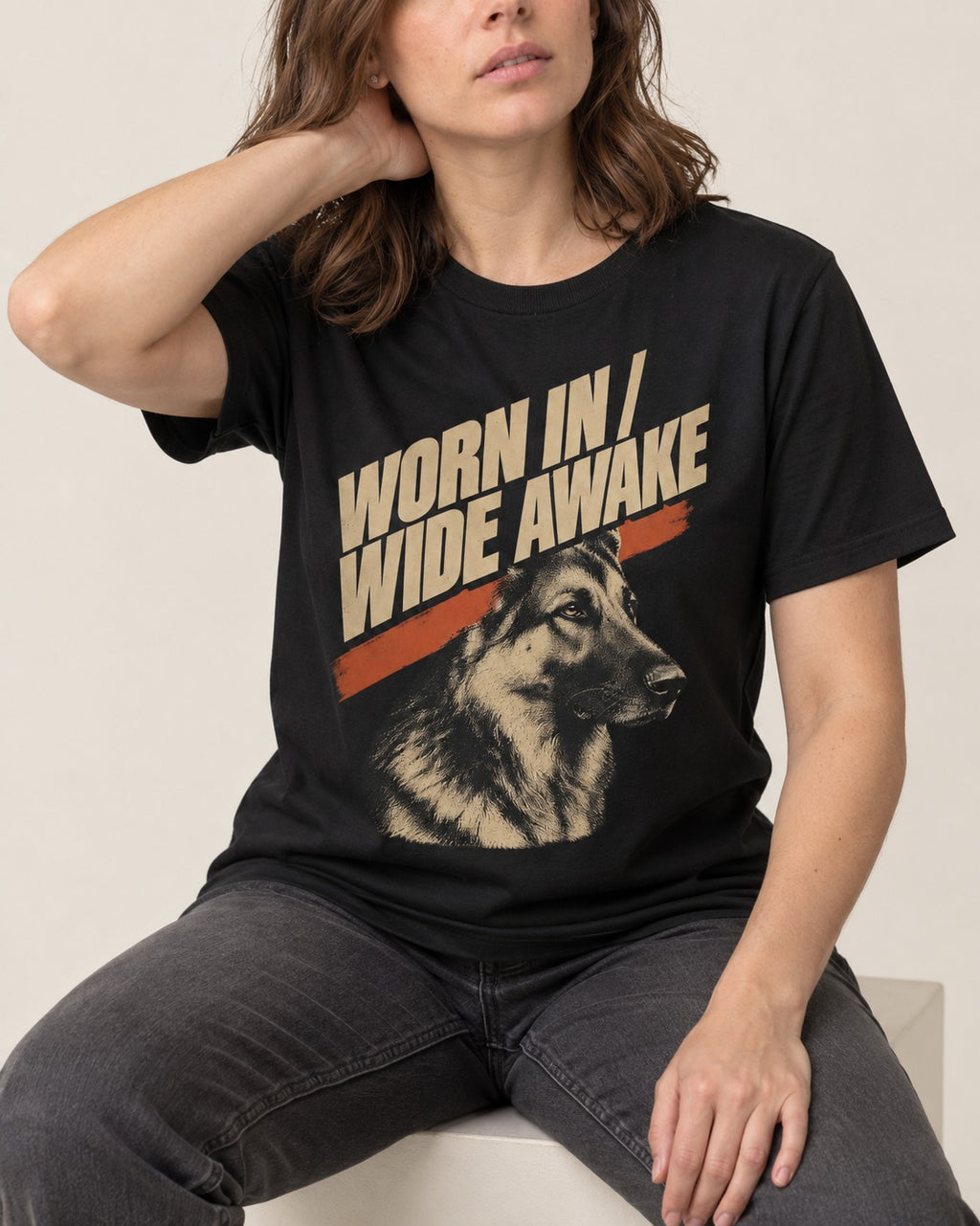 Worn In Wide Awake Portrait German Shepherd Dog Graphic T-Shirt in Black, worn by a seated model