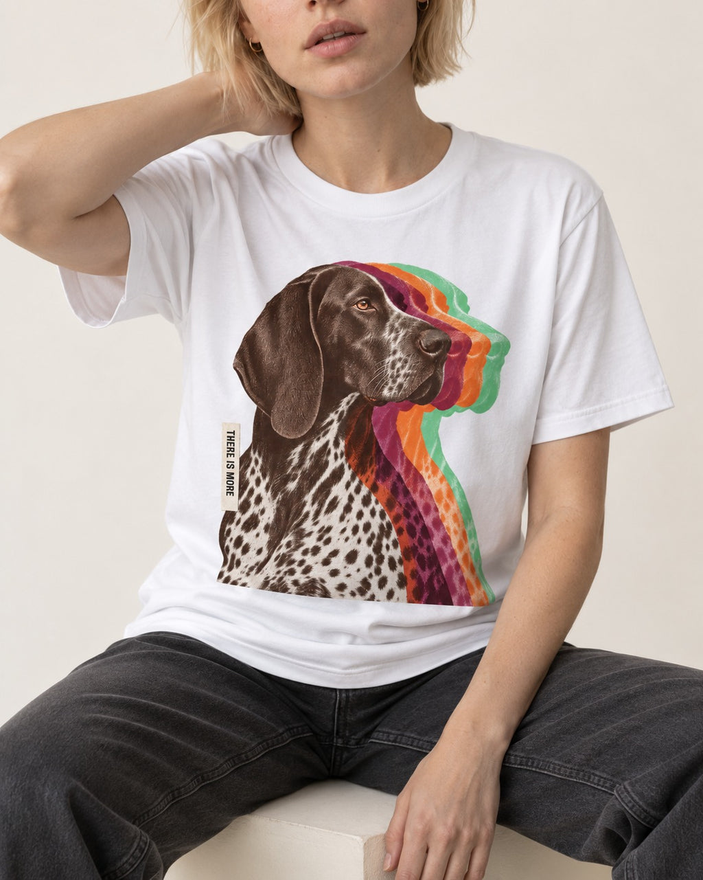 There Is More German Shorthaired Pointer T-Shirt in White, worn by a seated model