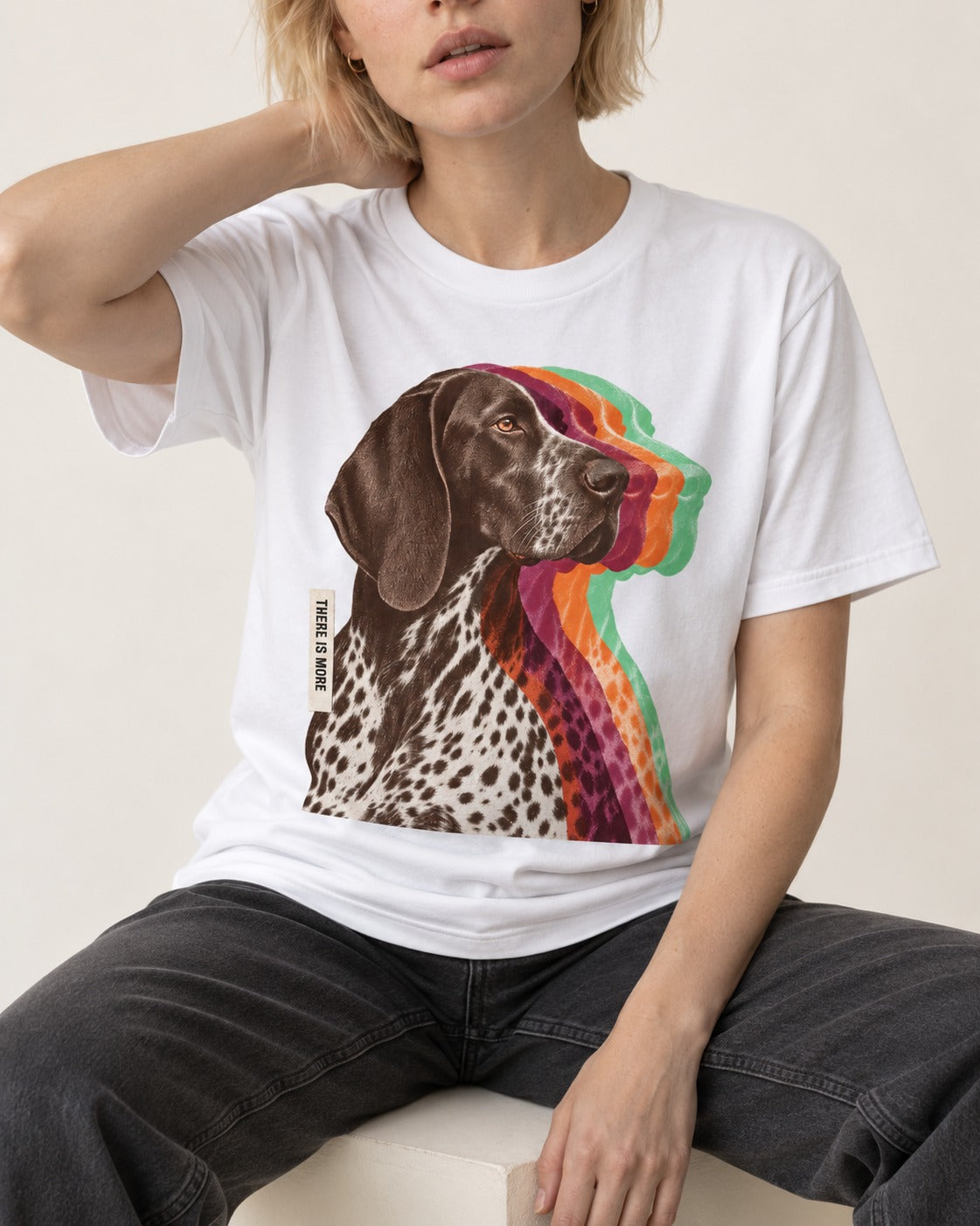 There Is More German Shorthaired Pointer T-Shirt in White, worn by a seated model