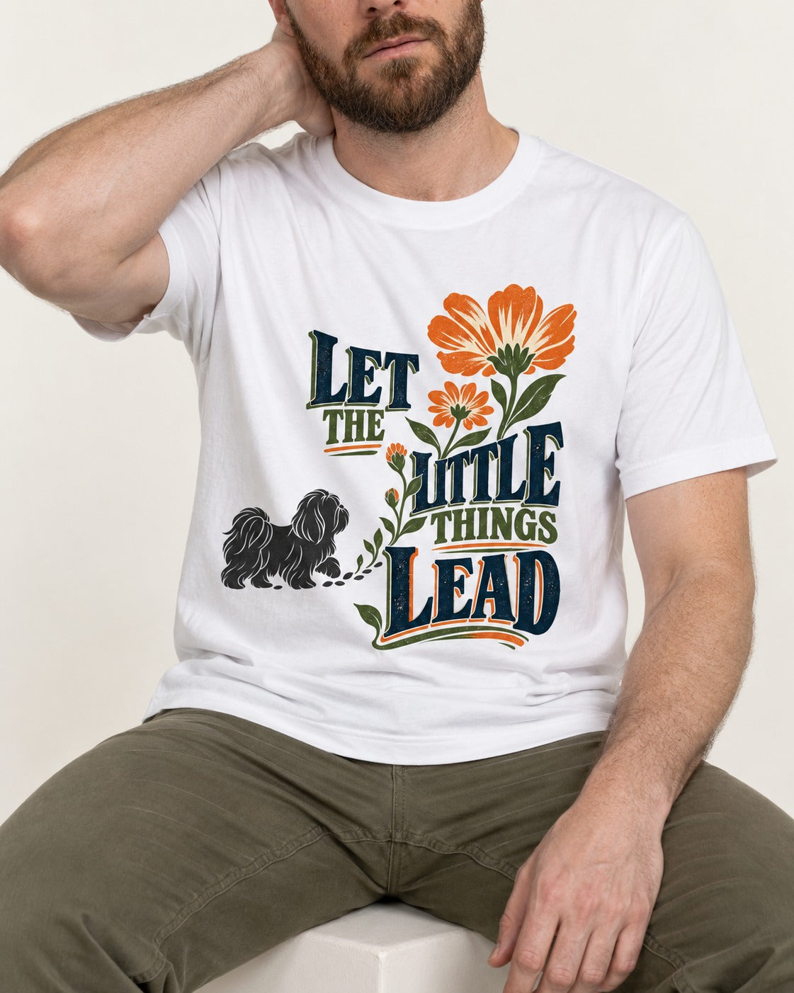 Let the Shih Tzu Lead T-Shirt in White, worn by a seated model