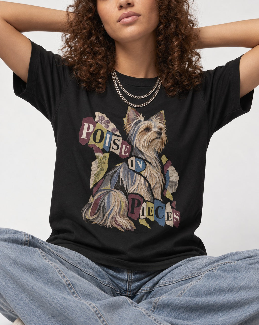 Yorkshire Terrier Poise in Pieces Torn Paper Collage Graphic T-Shirt in Black, worn by a seated model