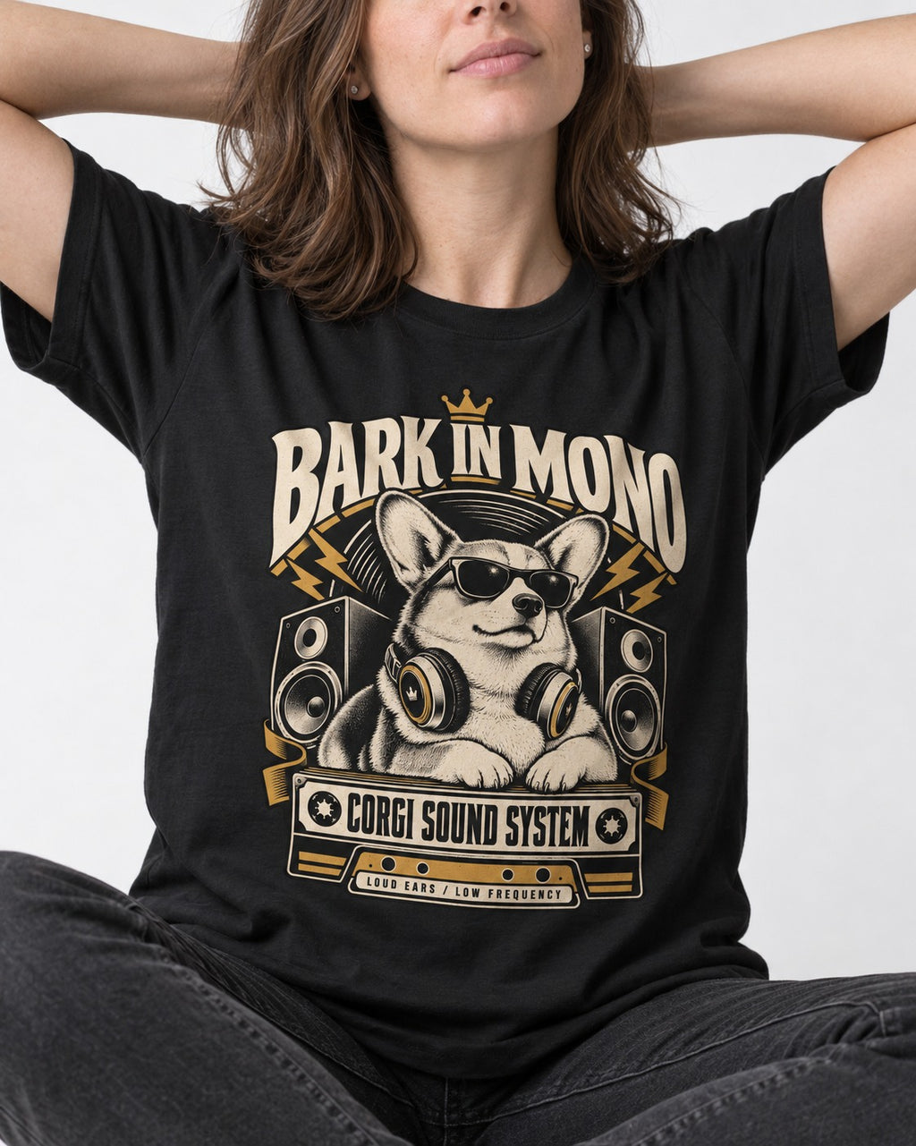 Corgi Bark in Mono Sound System T-Shirt in Black, worn by a seated model