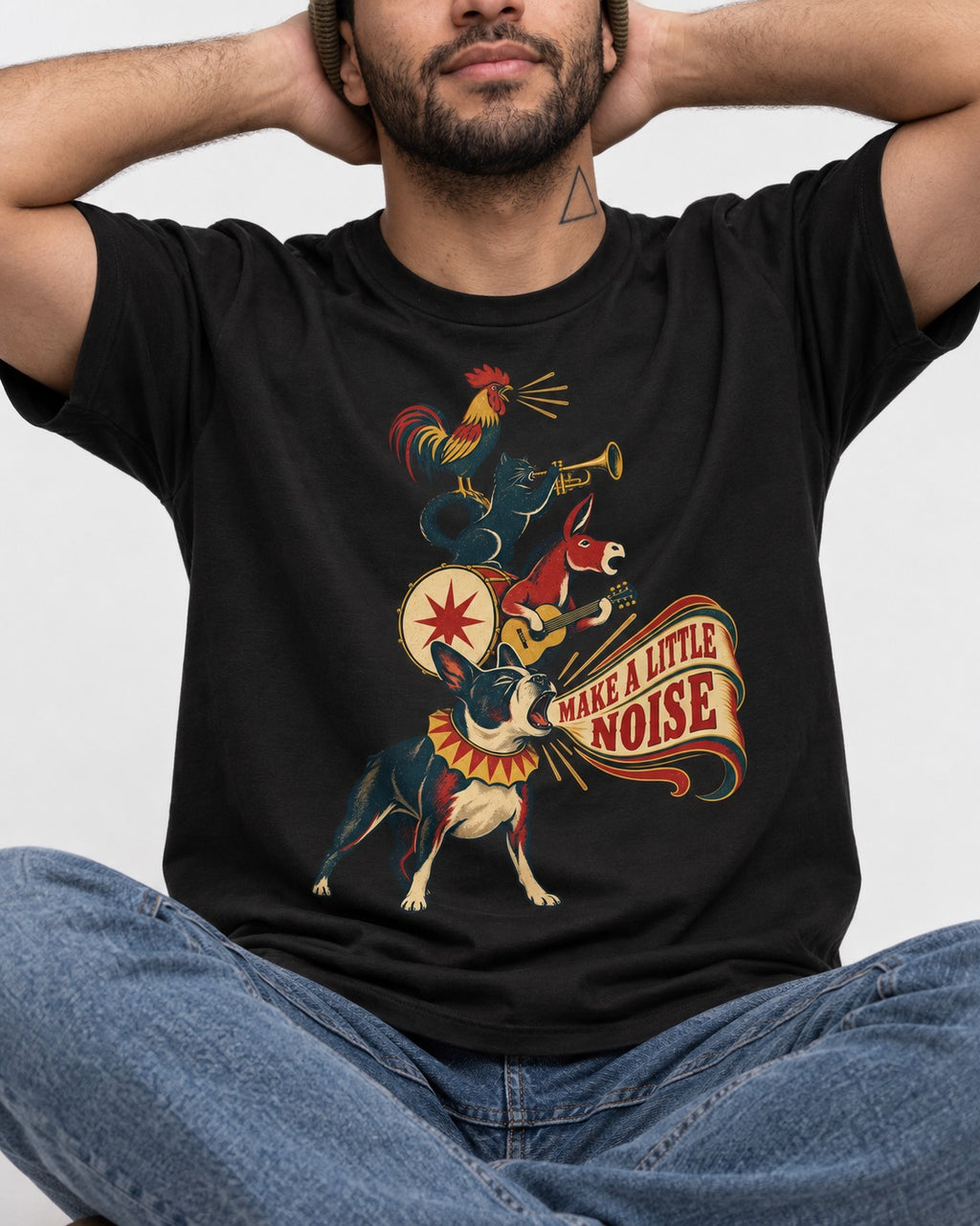 Boston Terrier Make A Little Noise T-Shirt in Black, worn by a seated model