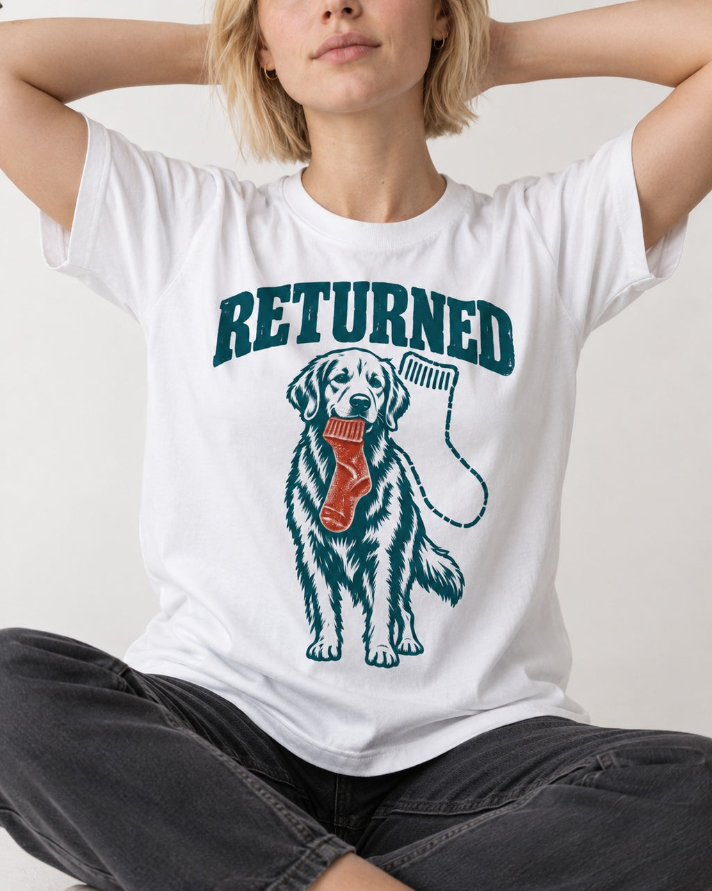 Golden Retriever Returned T-Shirt in White, worn by a seated model