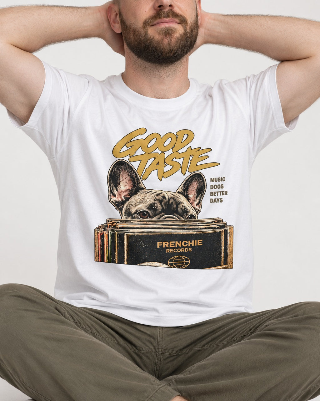 Frenchie's Good Taste T-Shirt in White, worn by a seated model