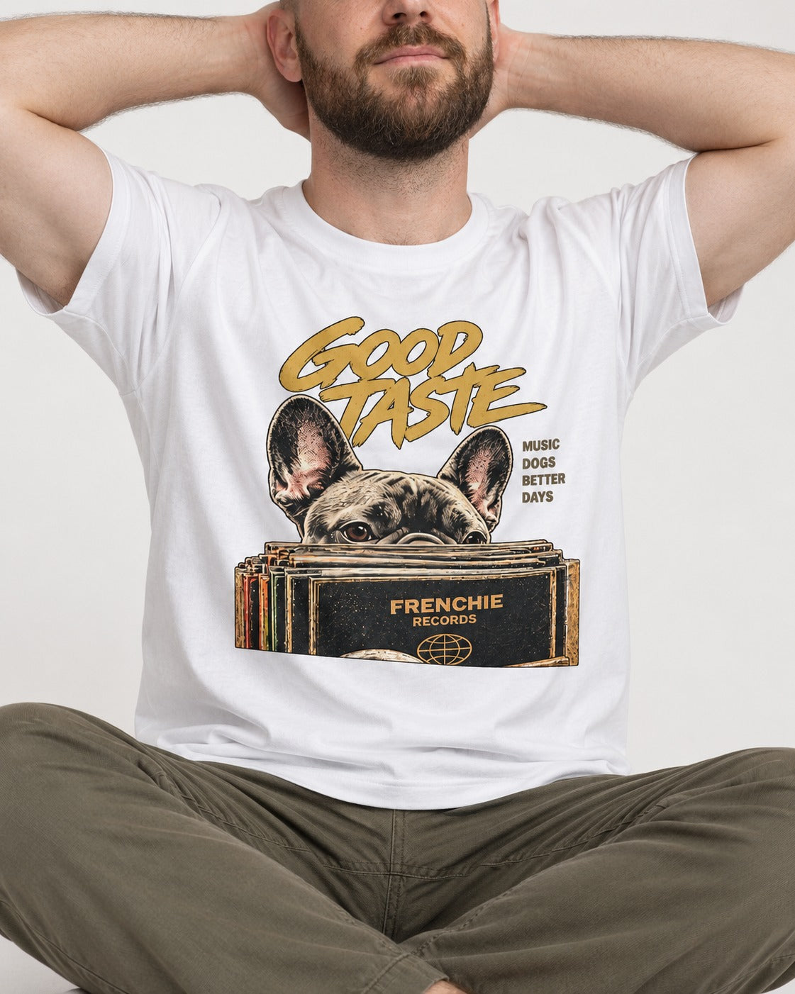 Frenchie's Good Taste T-Shirt in White, worn by a seated model