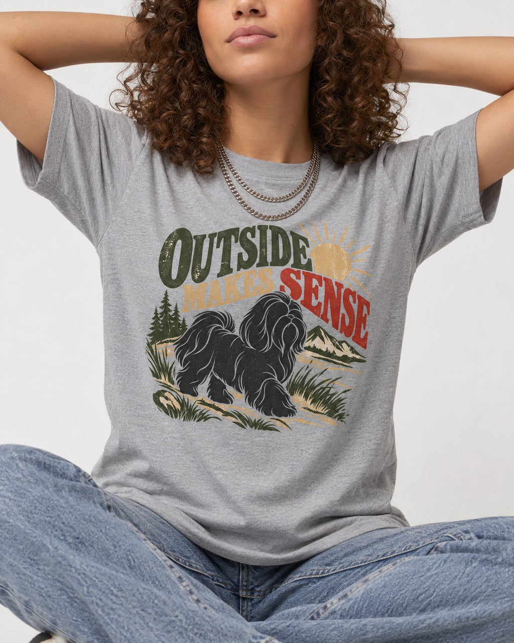 Shih Tzu Outside Makes Sense Mountain Trail Graphic T-Shirt in Sport Grey, worn by a seated model