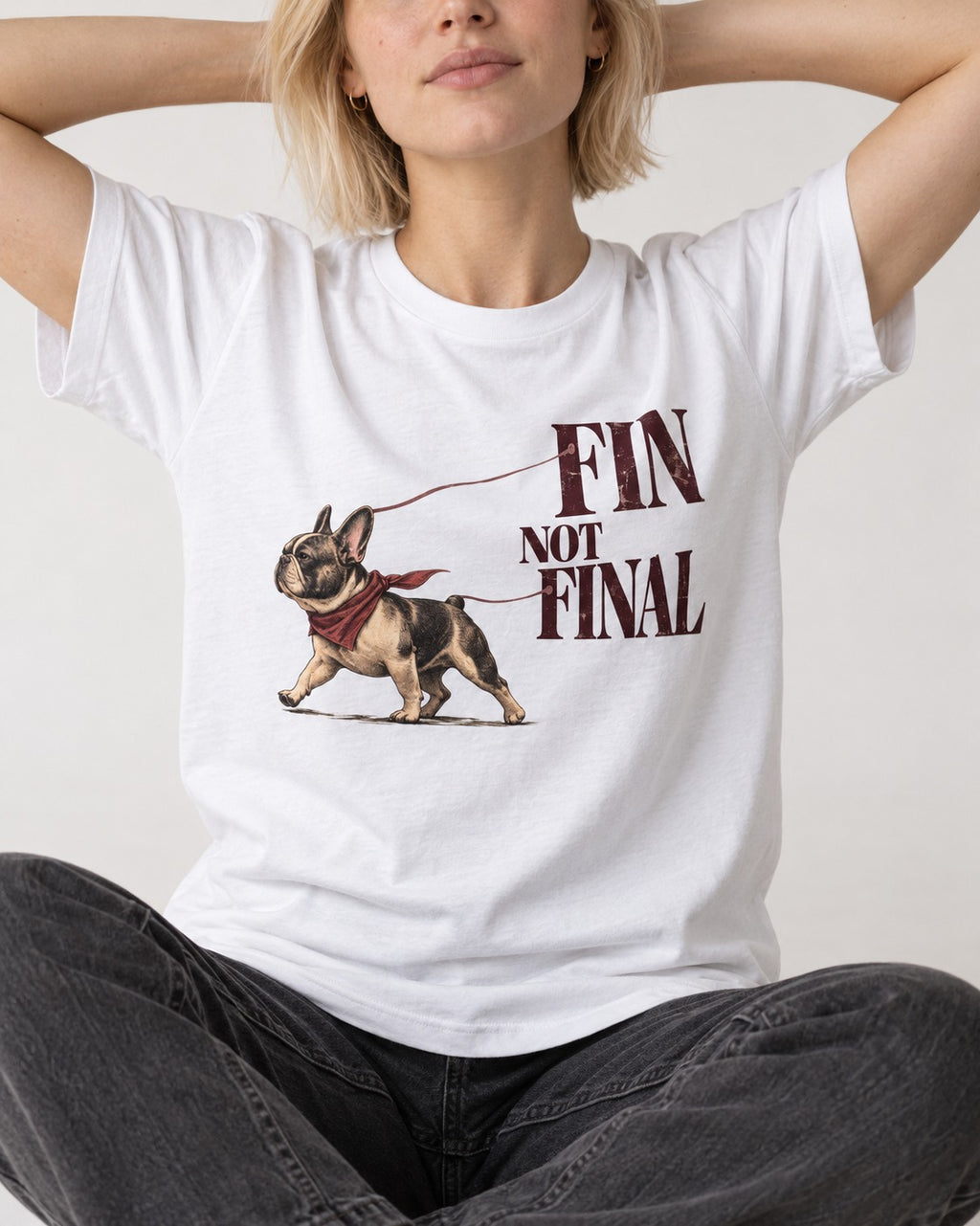 Frenchie Fin Not Final T-Shirt in White, worn by a seated model