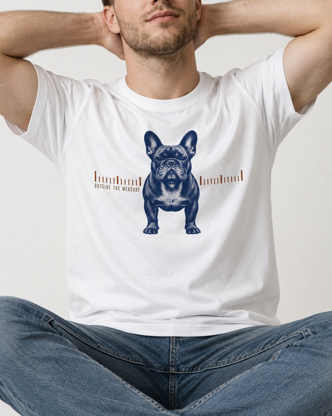 Frenchie Outside the Measure T-Shirt in White, worn by a seated model