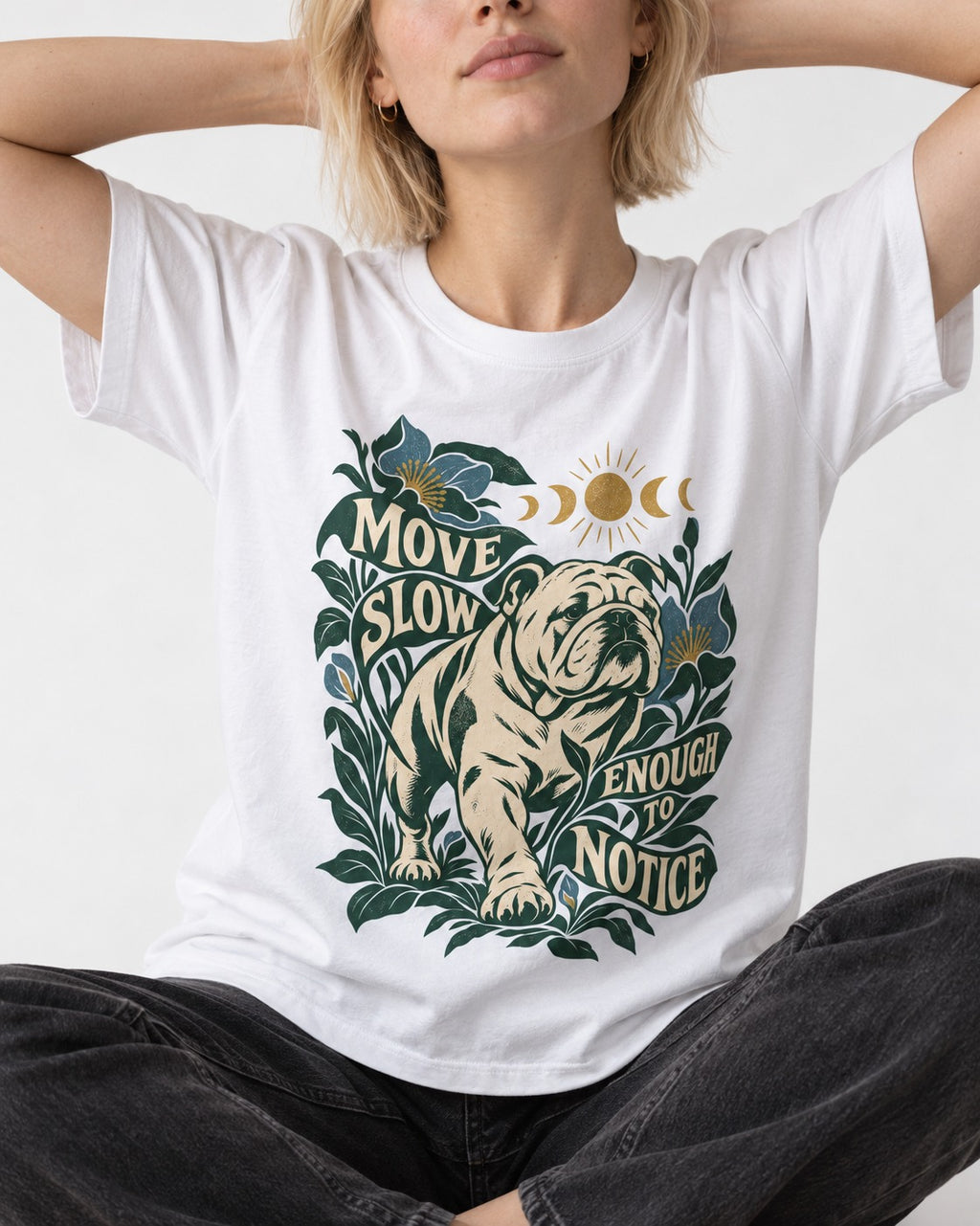 Move Slow English Bulldog T-Shirt in White, worn by a seated model