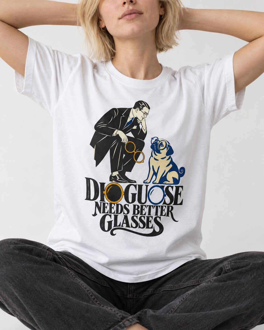 Pug Needs Better Glasses T-Shirt in White, worn by a seated model