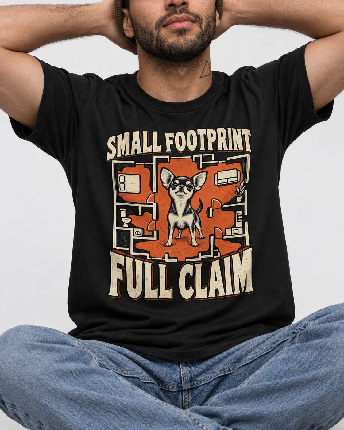 Chihuahua Small Footprint Full Claim Floor Plan Graphic T-Shirt in Black, worn by a seated model