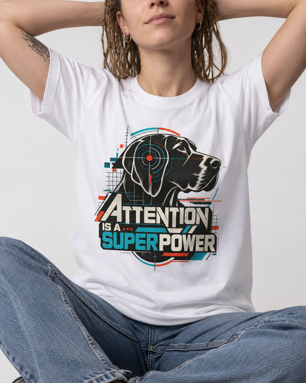 German Shorthaired Pointer Attention Is a Superpower T-Shirt in White, worn by a seated model