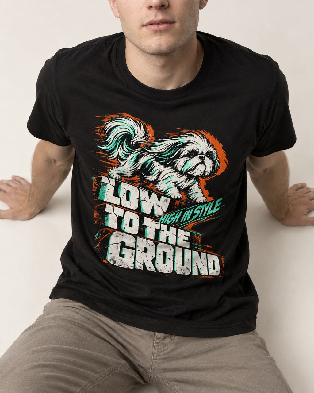 Shih Tzu Low to the Ground High in Style Streetwear Graphic T-Shirt in Black, worn by a seated model