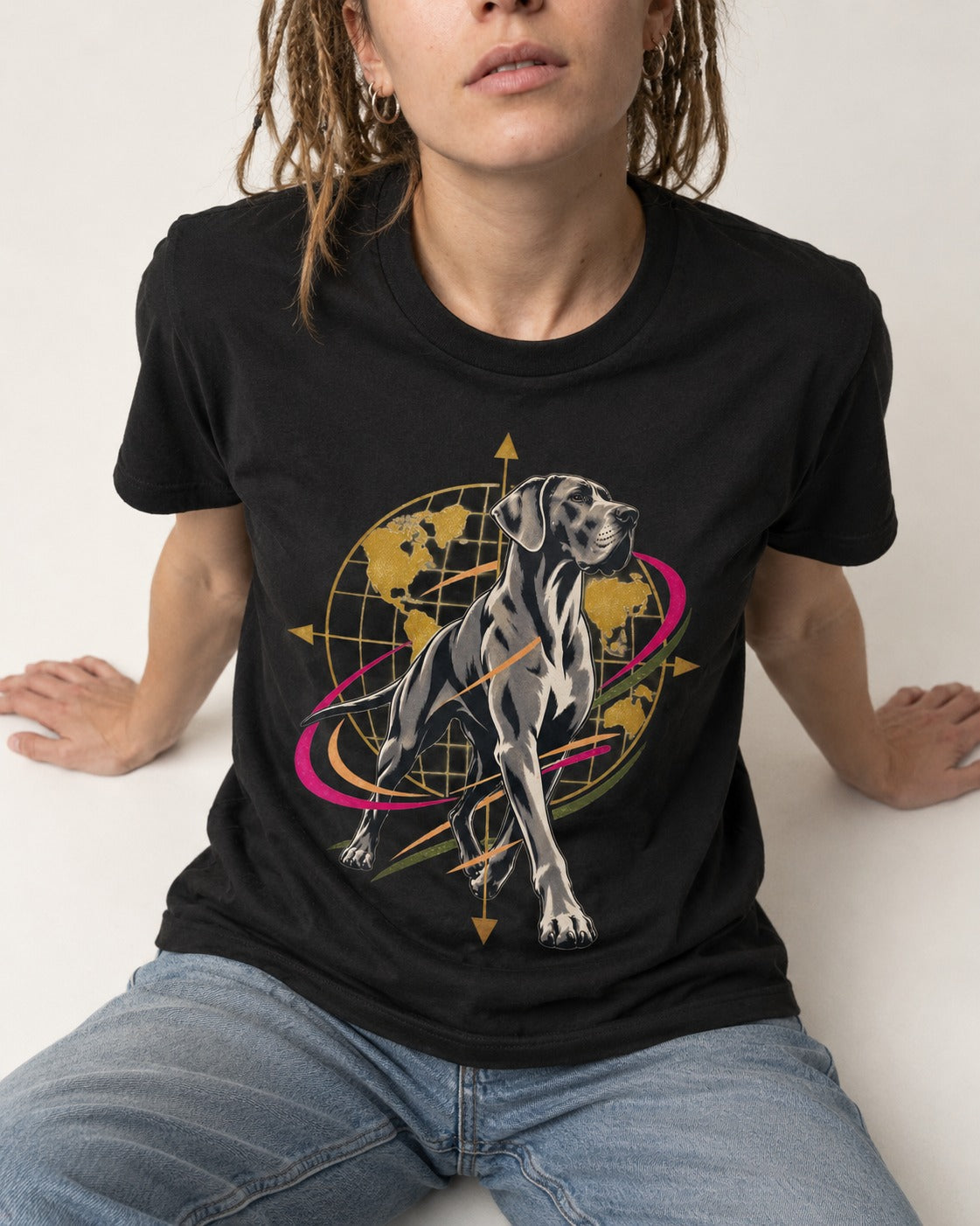 Great Dane Striding Globe Orbit Graphic T-Shirt in Black, worn by a seated model