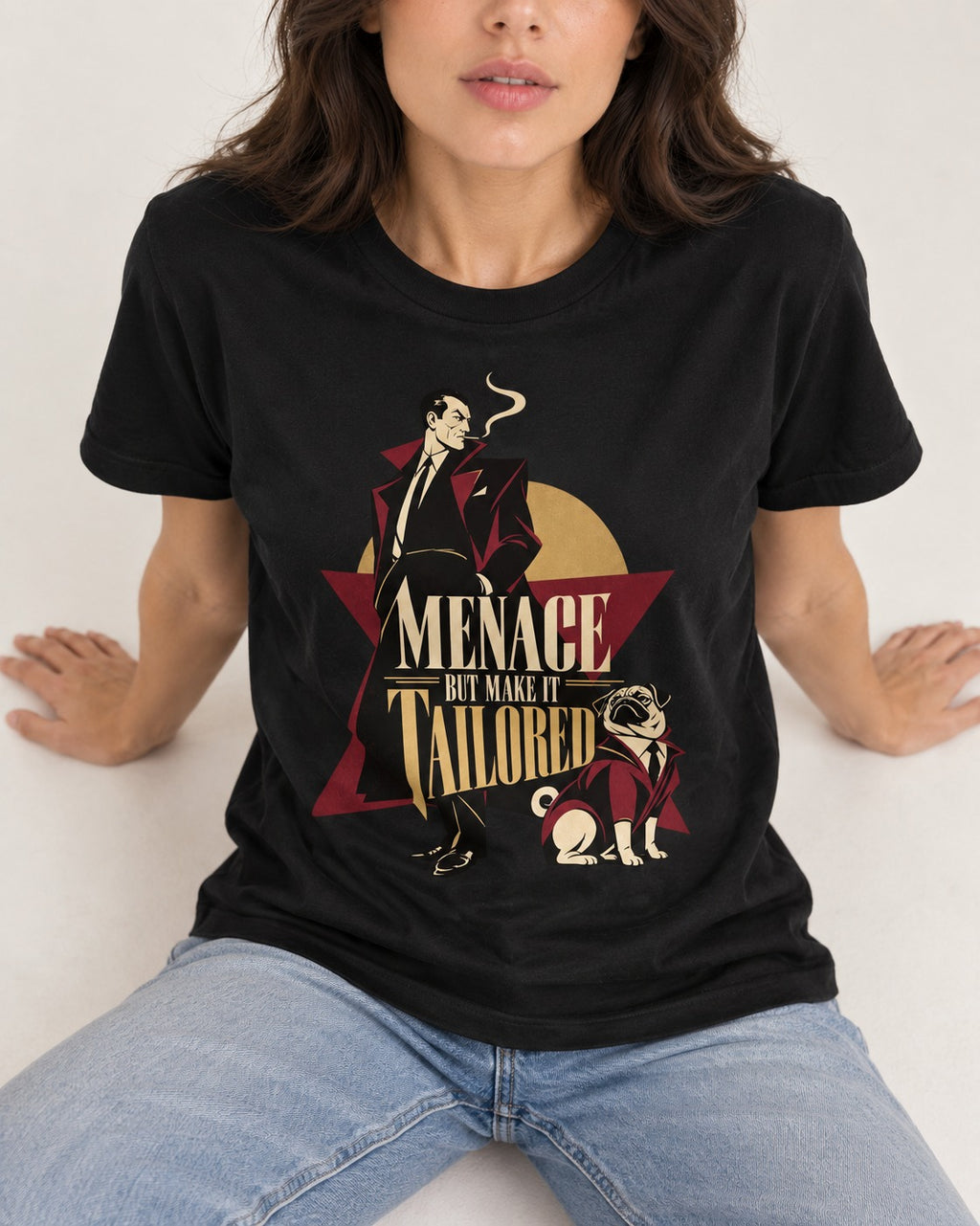 Pug Menace But Make It Tailored Graphic T-Shirt in Black, worn by a seated model