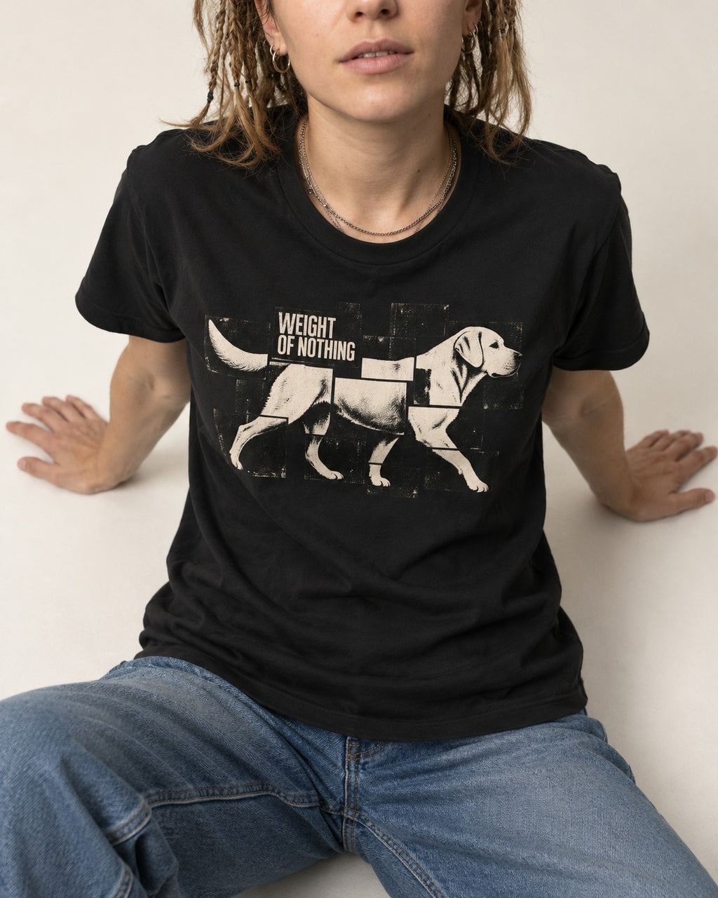 Labrador Retriever Weight of Nothing Fragmented Tile Graphic T-Shirt in Black, worn by a seated model