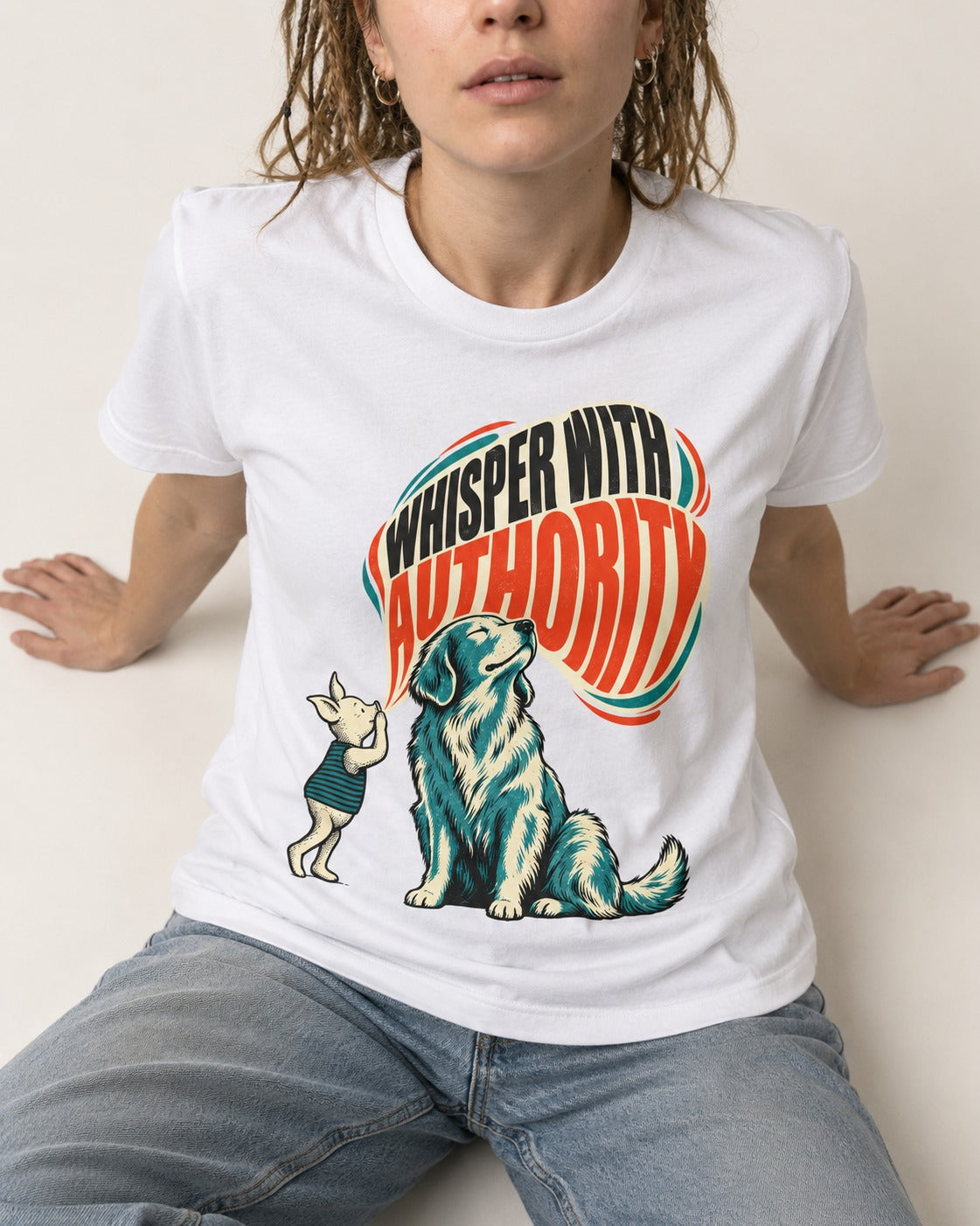 Golden Retriever Whisper with Authority T-Shirt in White, worn by a seated model