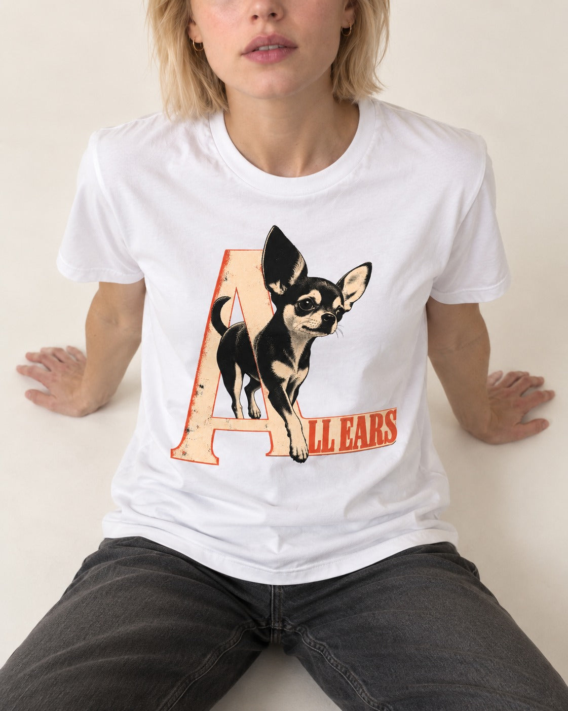 All Ears Chihuahua T-Shirt in White, worn by a seated model