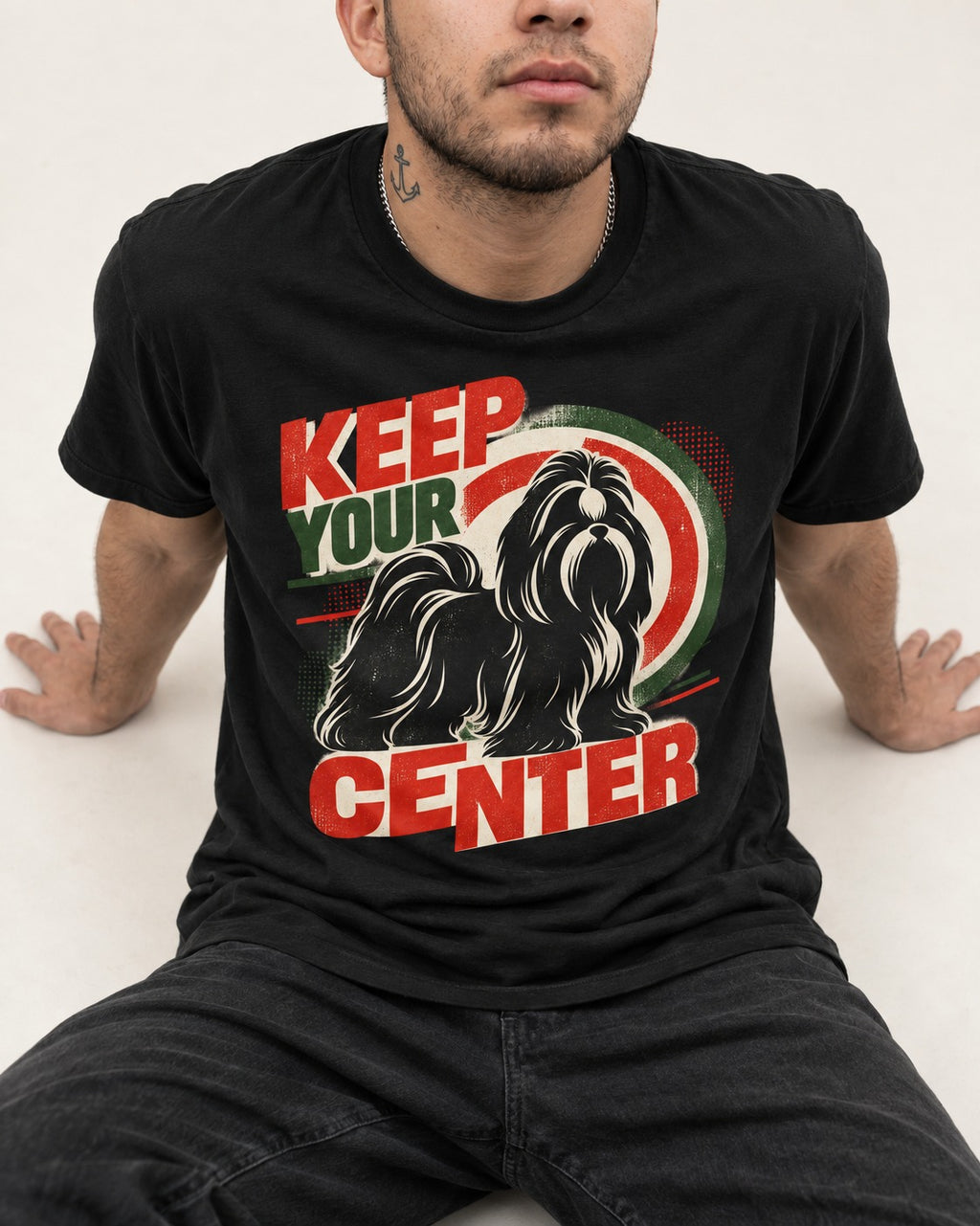 Shih Tzu Keep Your Center Retro Target Graphic T-Shirt in Black, worn by a seated model