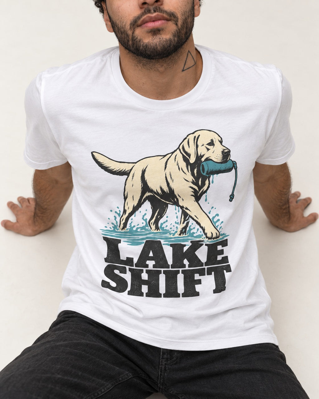 Lake Shift Labrador Retriever T-Shirt in White, worn by a seated model