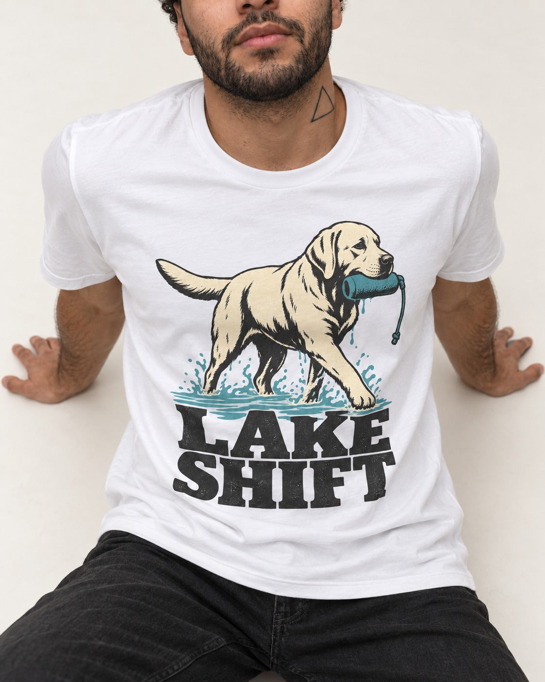 Lake Shift Labrador Retriever T-Shirt in White, worn by a seated model