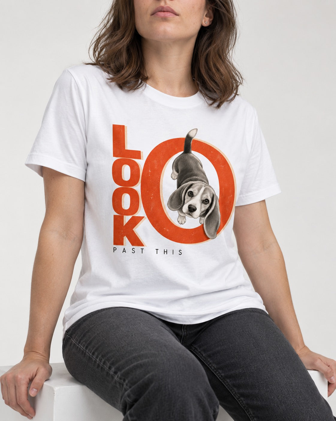 Look Past This Beagle T-Shirt in White, worn by a seated model