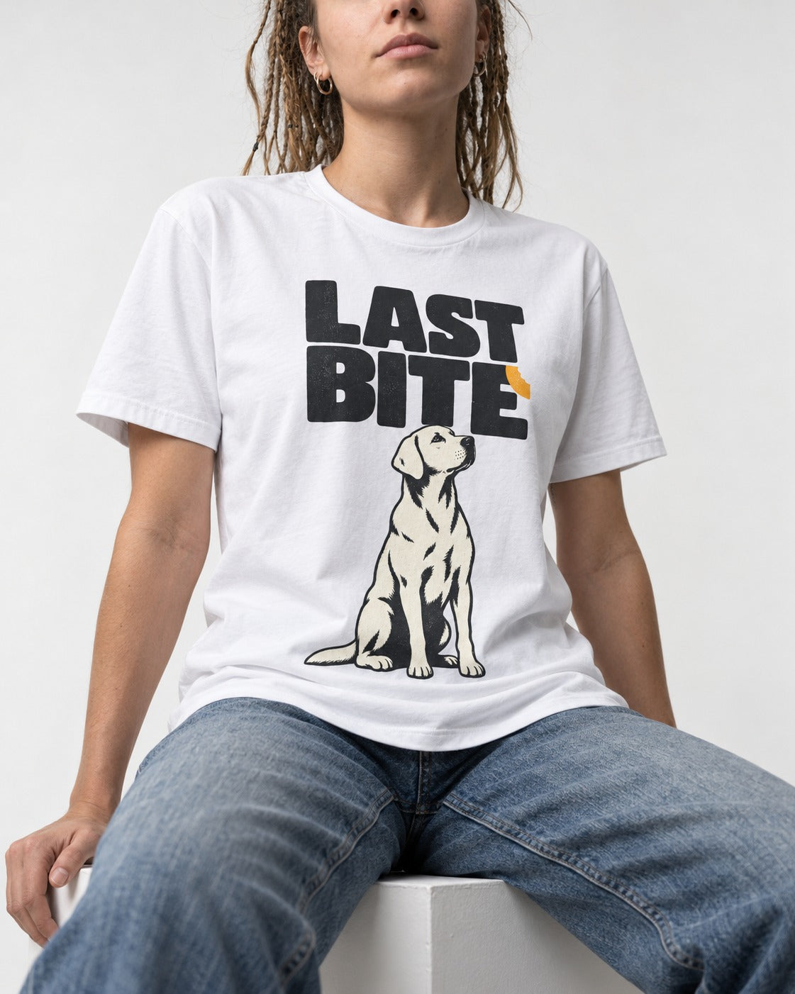Labrador Retriever's Last Bite T-Shirt in White, worn by a seated model