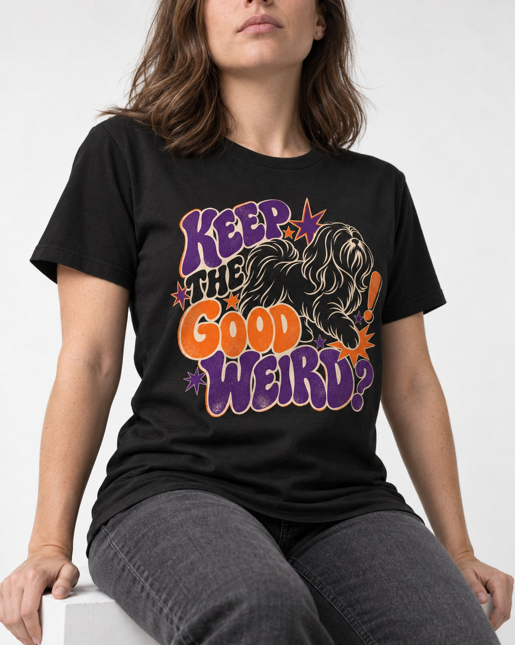 Shih Tzu Keep the Good Weird Retro Typography Graphic T-Shirt in Black, worn by a seated model