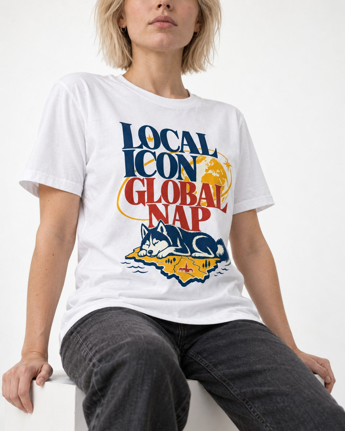 Husky Local Icon Global Nap T-Shirt in White, worn by a seated model