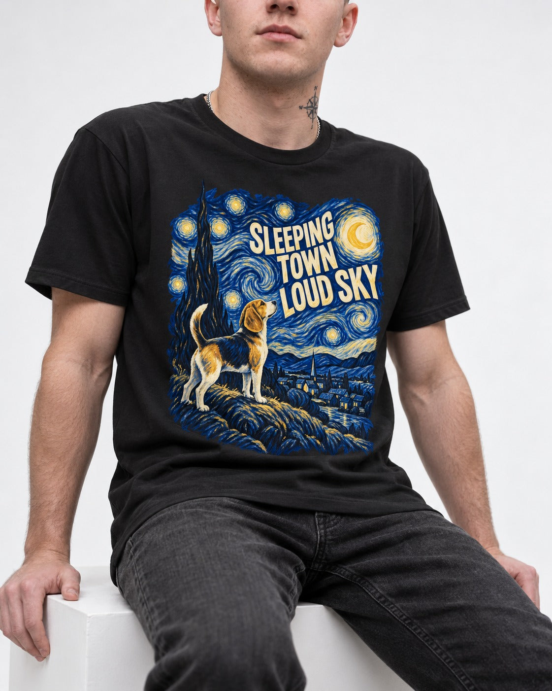 Sleeping Town Loud Sky Beagle Nightscape T-Shirt in Black, worn by a seated model