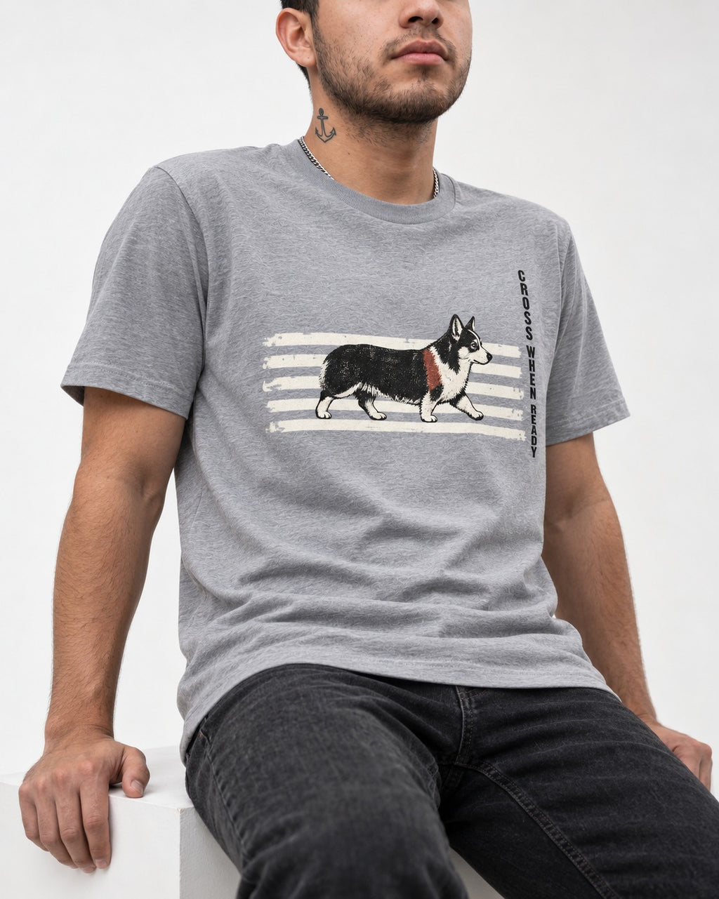 Corgi Cross When Ready Crossing Bars Graphic T-Shirt in Sport Grey, worn by a seated model