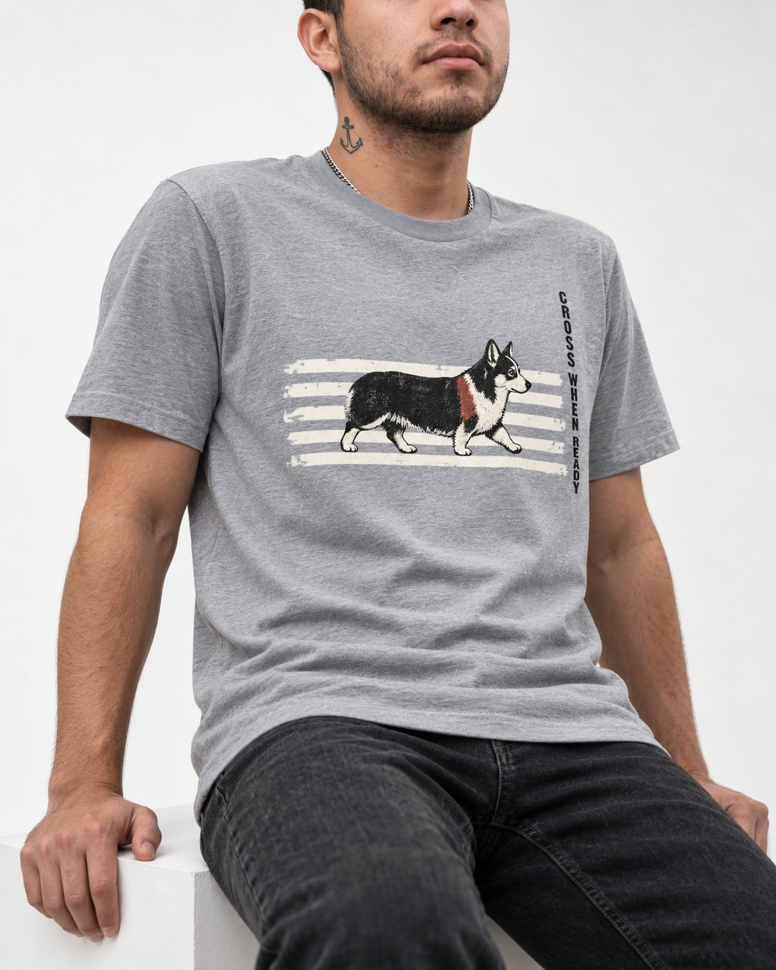 Corgi Cross When Ready Crossing Bars Graphic T-Shirt in Sport Grey, worn by a seated model