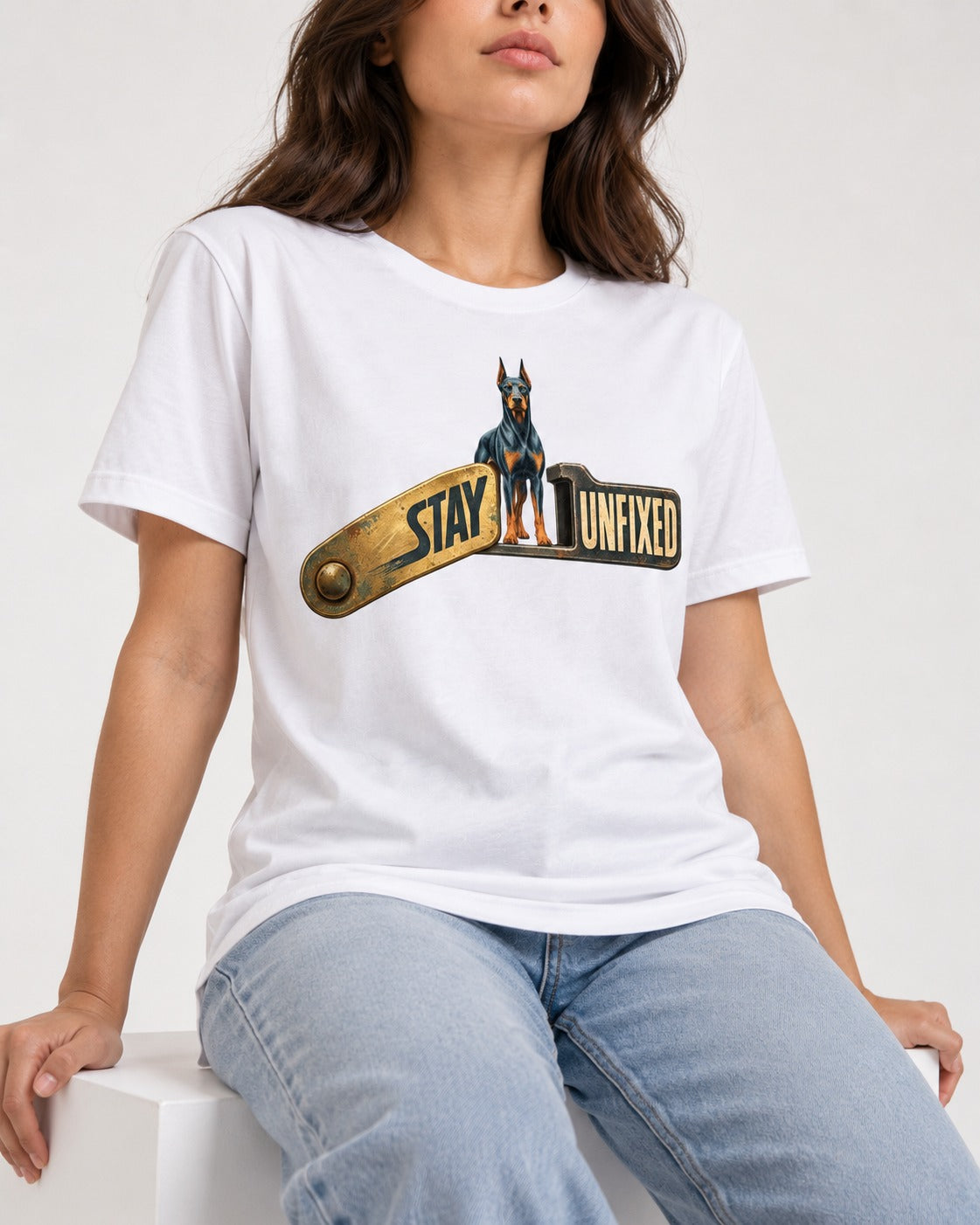Doberman Stay Unfixed T-Shirt in White, worn by a seated model