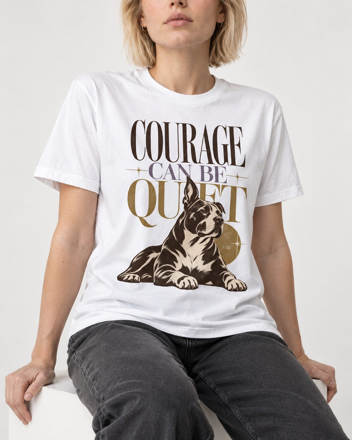 Pitbull Courage Can Be Quiet T-Shirt in White, worn by a seated model