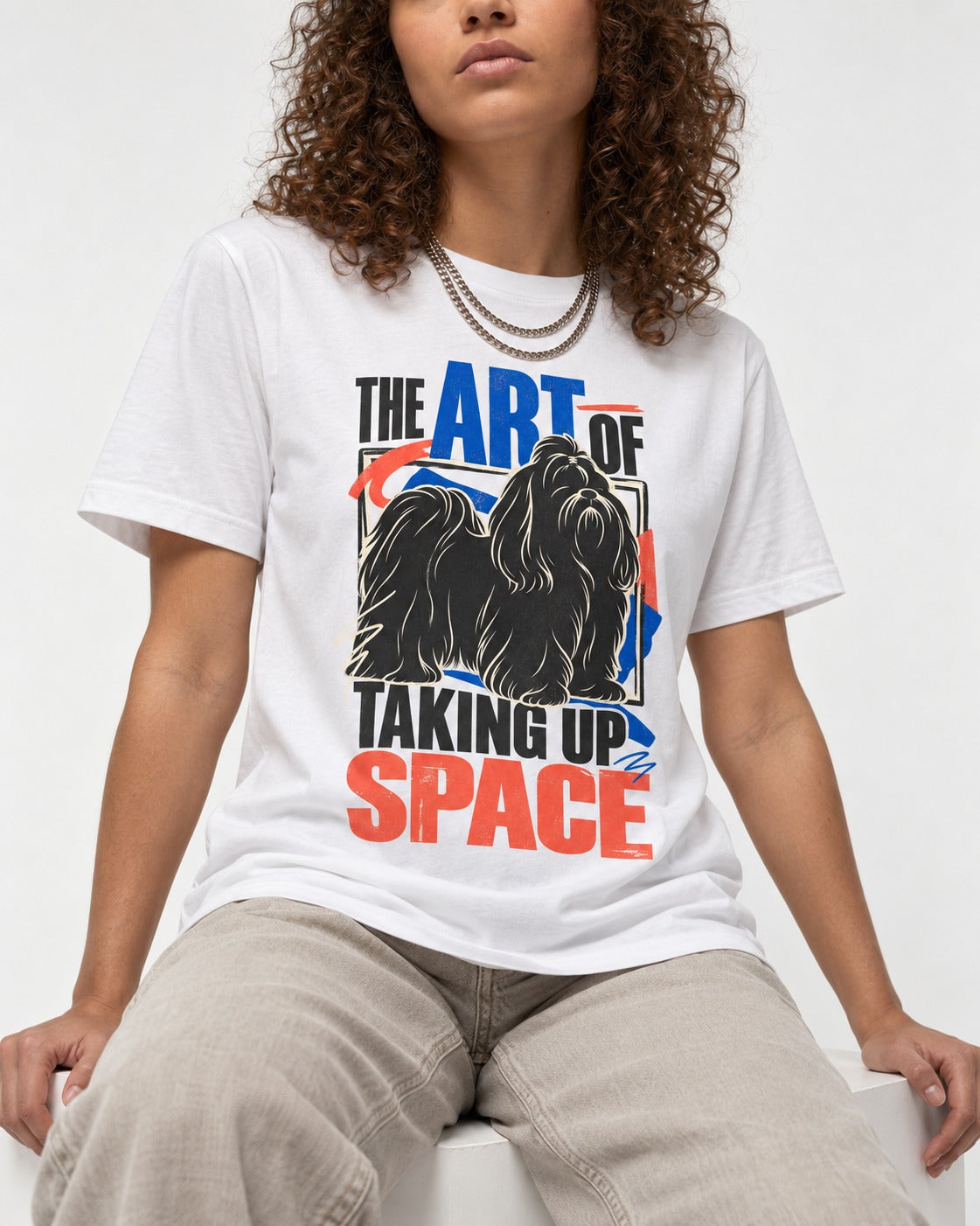 Shih Tzu Taking Up Space T-Shirt in White, worn by a seated model