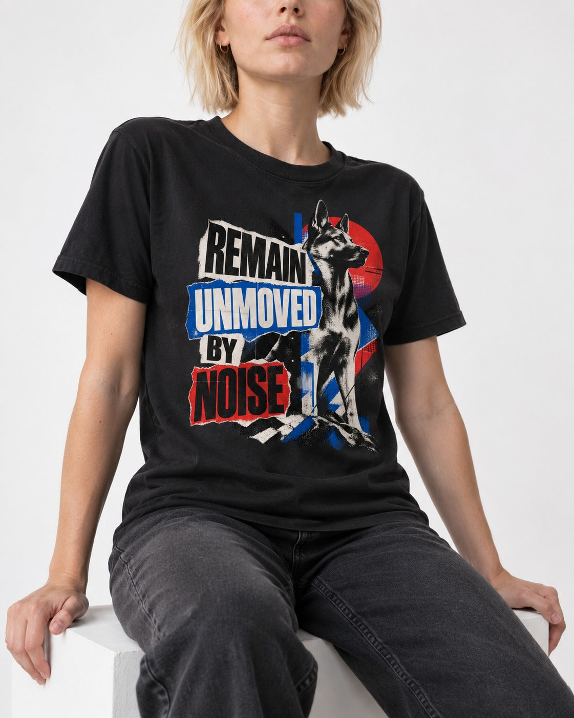 Remain Unmoved By Noise Brutalist Collage German Shepherd Dog Graphic T-Shirt in Black, worn by a seated model