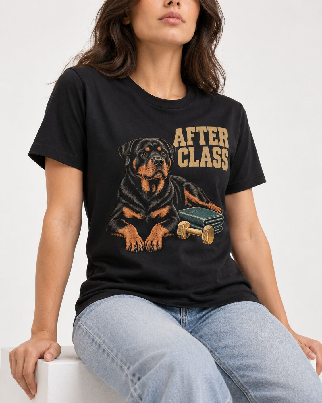 Rottweiler After Class Books and Dumbbell Graphic T-Shirt in Black, worn by a seated model