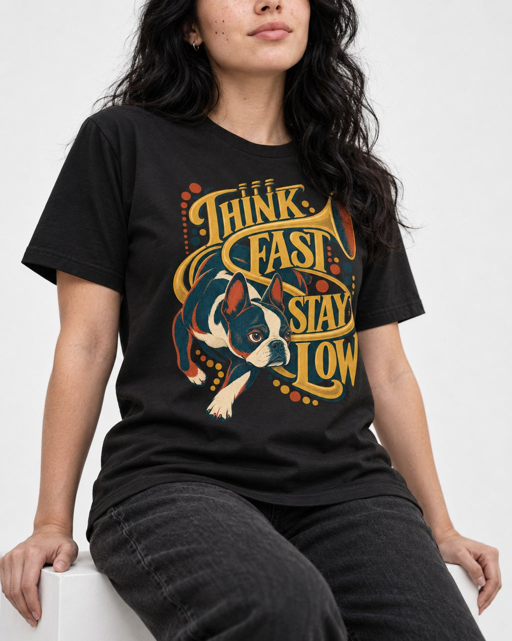 Boston Terrier Think Fast Stay Low T-Shirt in Black, worn by a seated model
