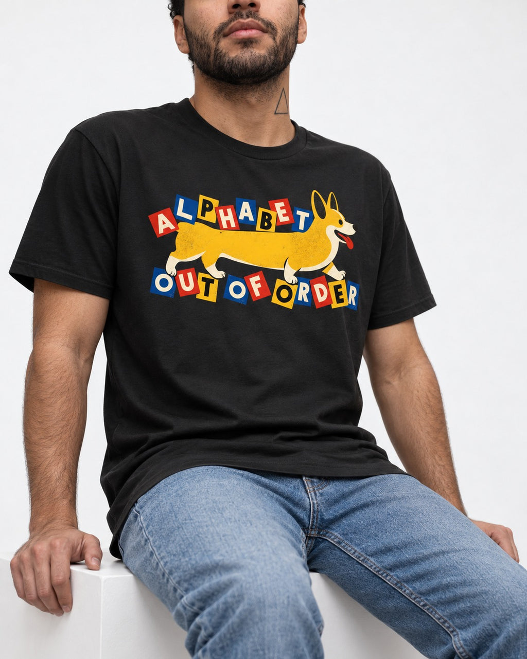 Corgi Alphabet Out of Order Graphic T-Shirt in Black, worn by a seated model