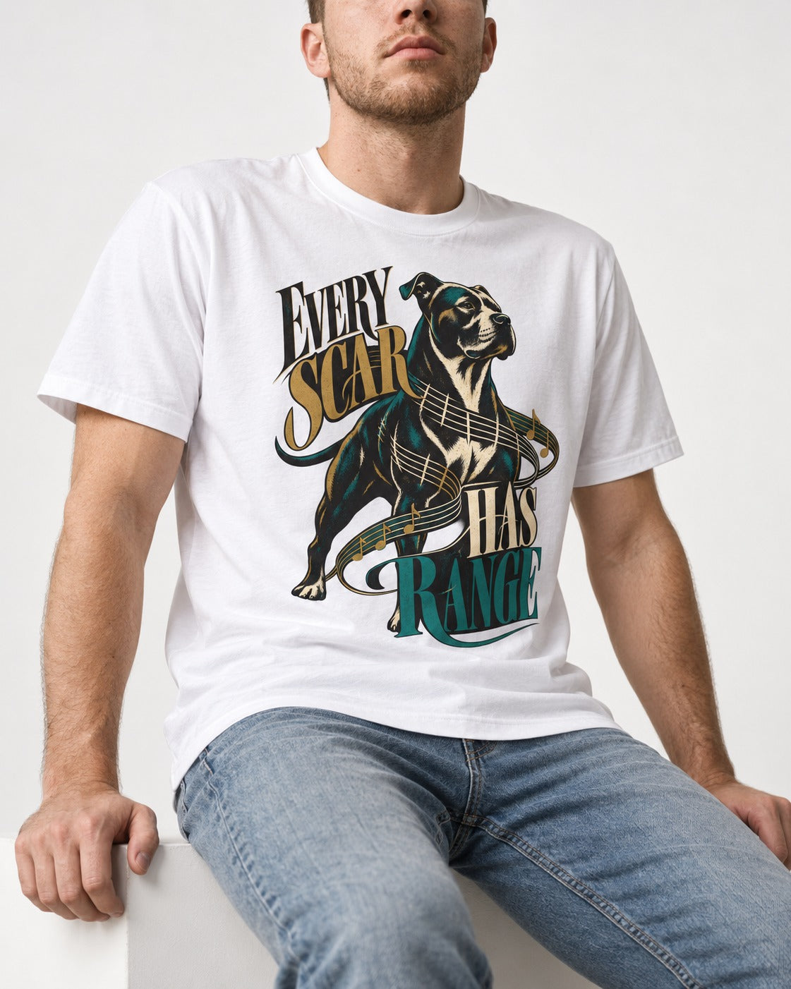 Every Pitbull Scar Has Range T-Shirt in White, worn by a seated model