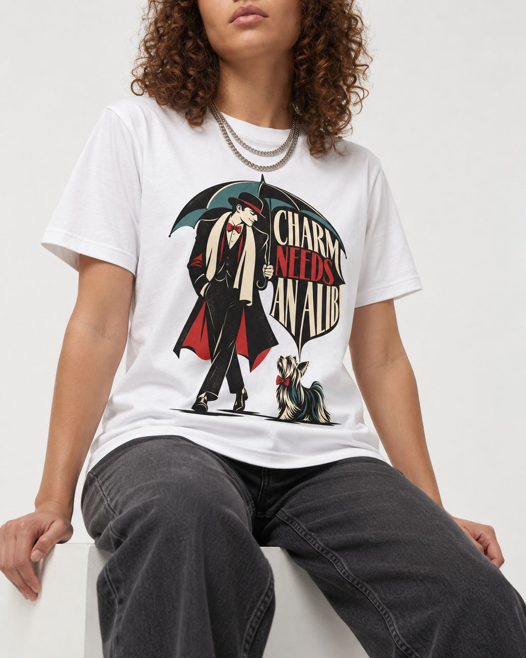 Charm Needs an Alibi Yorkshire Terrier T-Shirt in White, worn by a seated model