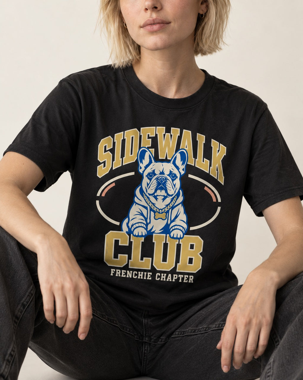 Frenchie Sidewalk Club Chapter Graphic T-Shirt in Black, worn by a seated model